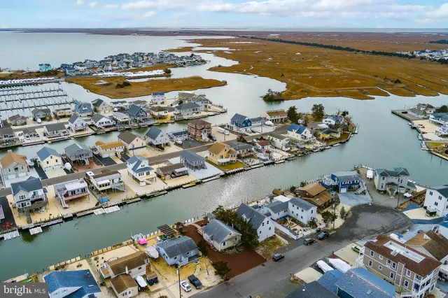 an aerial view of a city with ocean view