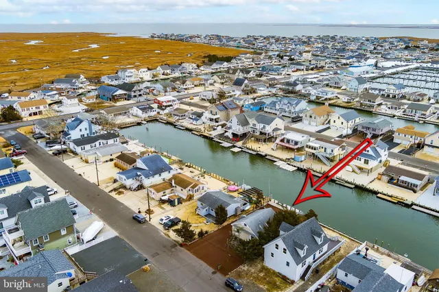 a view of a house with wooden fence