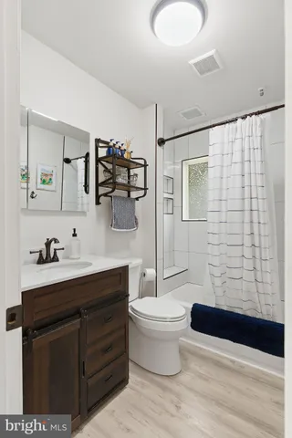 a bedroom with bed and a couch