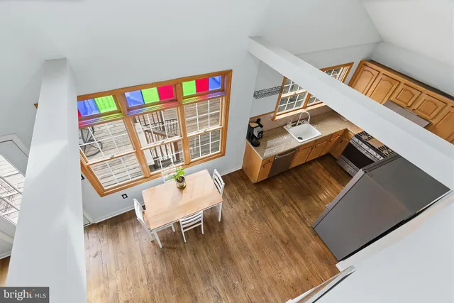 a workspace with furniture and wooden floor
