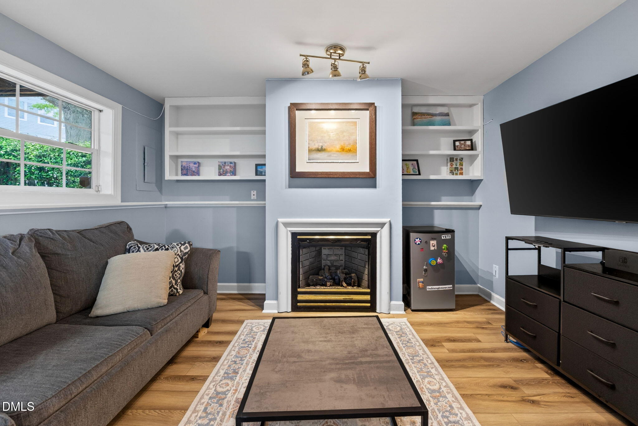 5500 Vista View Court Raleigh, NC 27612 - Photo 23 of 38 a living room with furniture and a flat screen tv