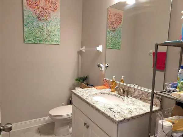 a utility room with sink dryer and washer