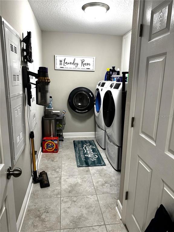 7545 Pool Compass Loop Wesley Chapel, FL 33545 - Photo 24 of 25 a view of utility room and washer and dryer