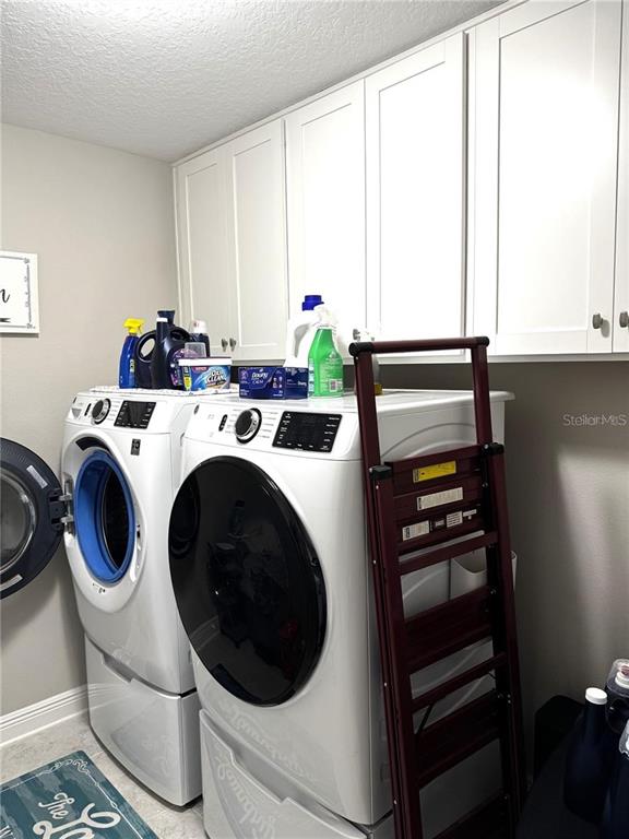 7545 Pool Compass Loop Wesley Chapel, FL 33545 - Photo 25 of 25 a utility room with sink dryer and washer