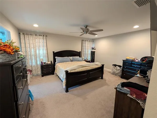 a bedroom with furniture and a fireplace