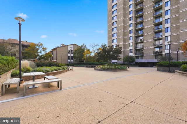 a view of a building with backyard