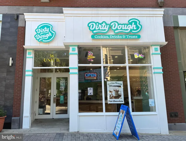 a view of a shop with a street
