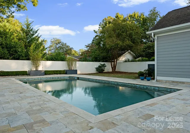 a view of a swimming pool with a chair
