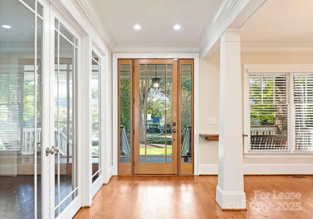 a view of entryway with wooden floor