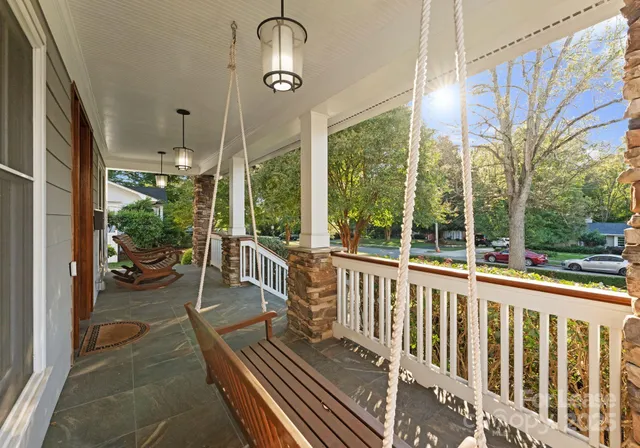a view of a balcony with chairs