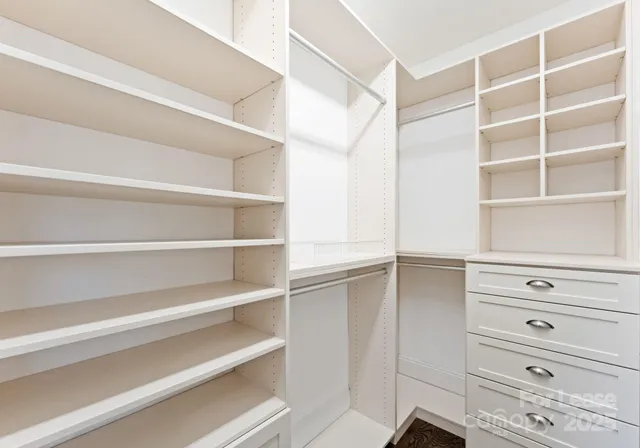 a view of an empty walk in closet