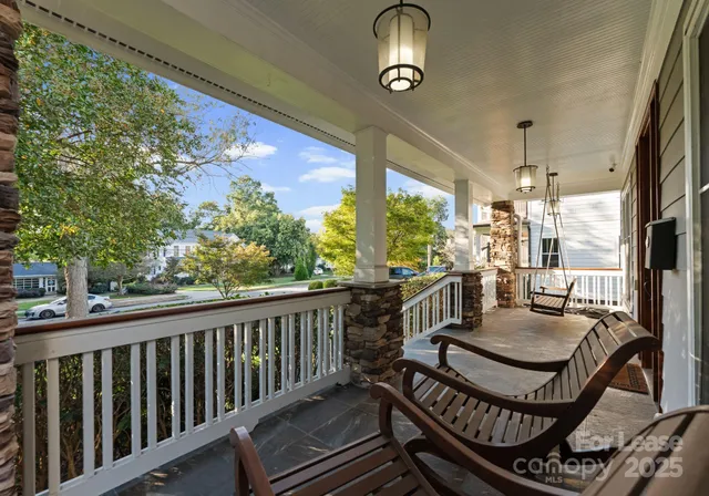 a view of a balcony with chairs
