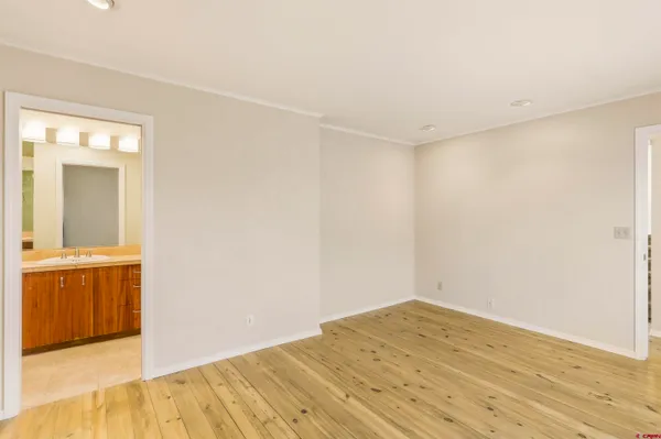 a view of an entryway with wooden floor