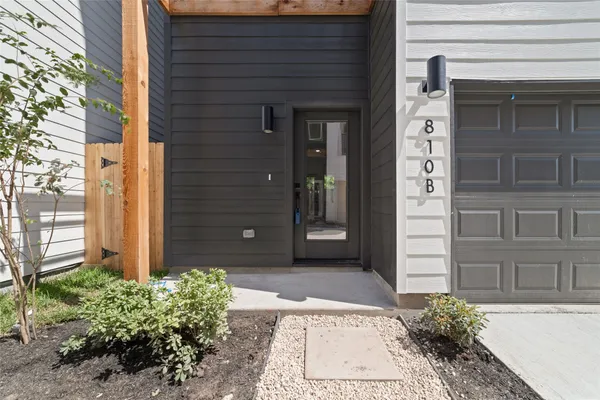 a view of a brick house with a large window