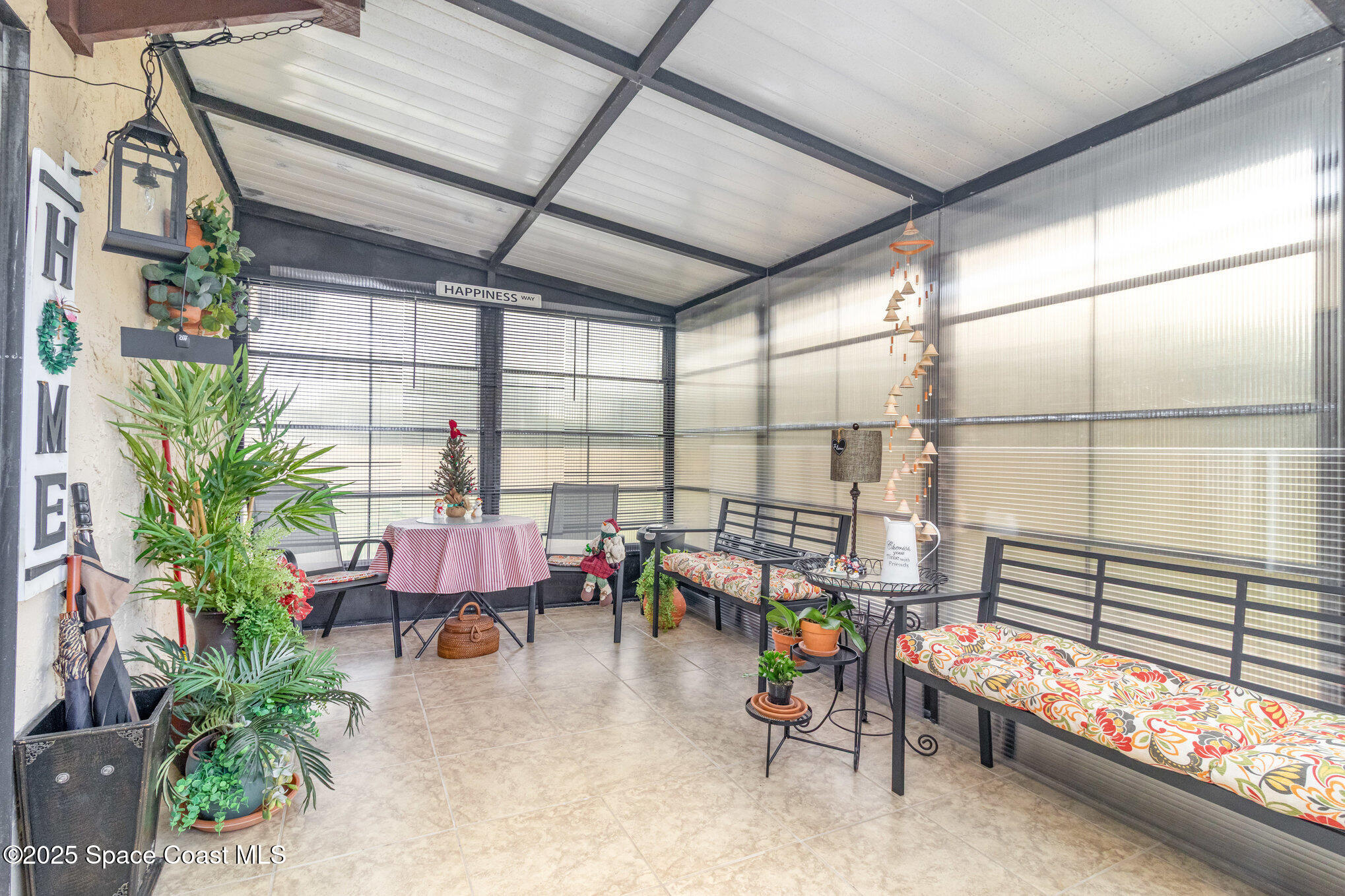 1679 Dawes Road Northeast Palm Bay, FL 32905 - Photo 13 of 15 a reading room with furniture and a potted plant