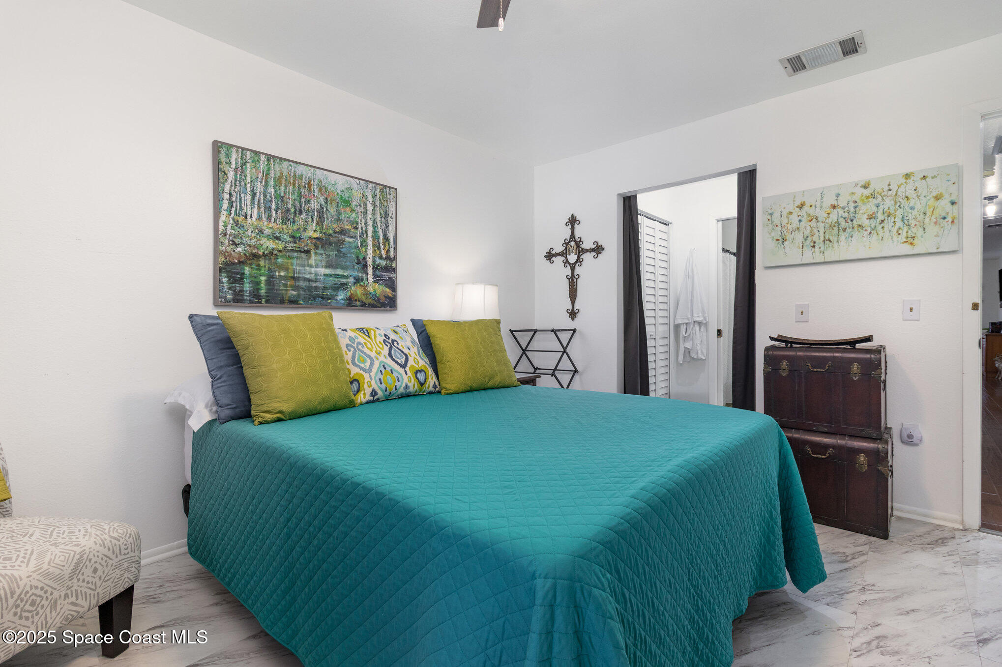 1679 Dawes Road Northeast Palm Bay, FL 32905 - Photo 10 of 15 a bedroom with a bed and wooden floor