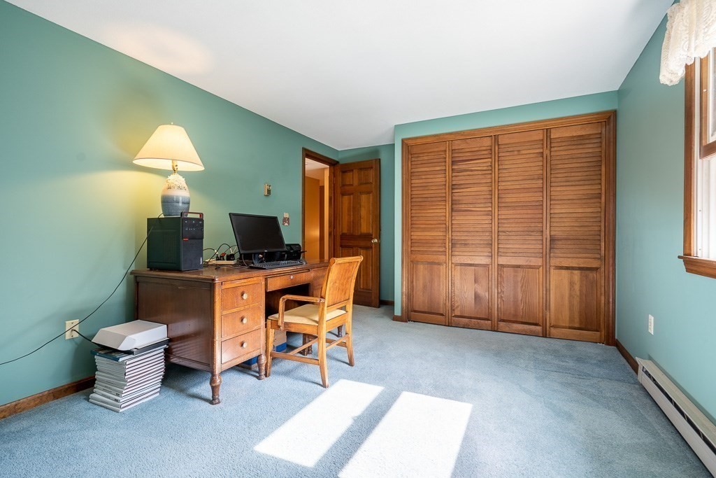 38 Zuell Hill Road Monson, MA 01057 - Photo 29 of 42 a living room with furniture a flat screen tv and a window