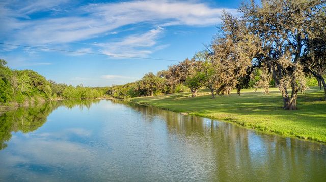 a view of a lake with a yard