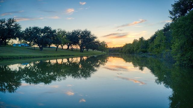 a view of a lake with a big yard