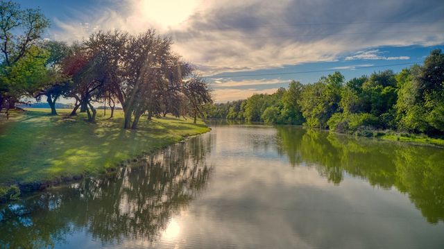 a view of lake with green space