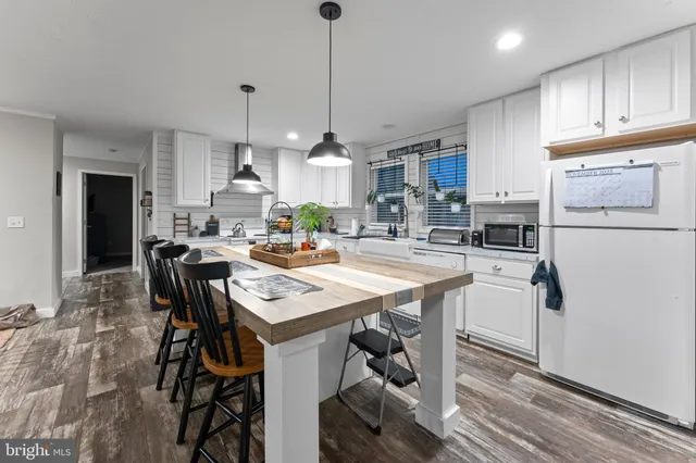 a living room with furniture fireplace and a window