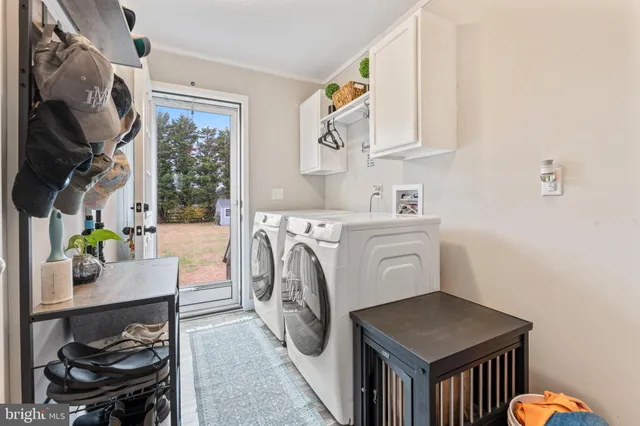 a bedroom with a bed mirror and a window