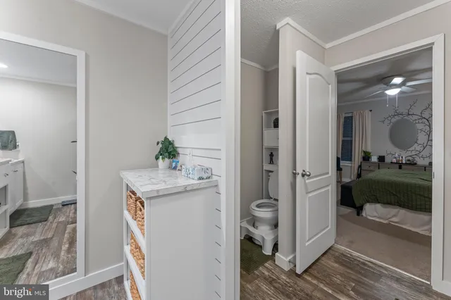 a bathroom with a sink a mirror and a shower