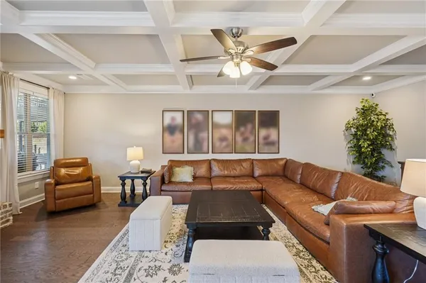a living room with furniture fireplace and a view of kitchen