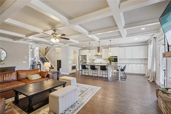 a kitchen with sink and refrigerator