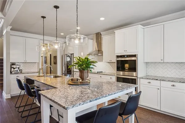 a bathroom with a tub shower and sink