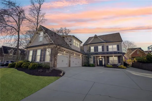 an aerial view of multiple houses with yard