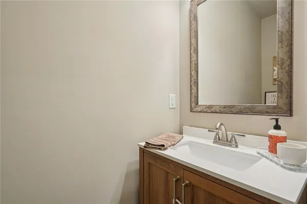 a living room with furniture a ceiling fan and a window