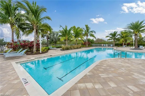a view of swimming pool with outdoor seating