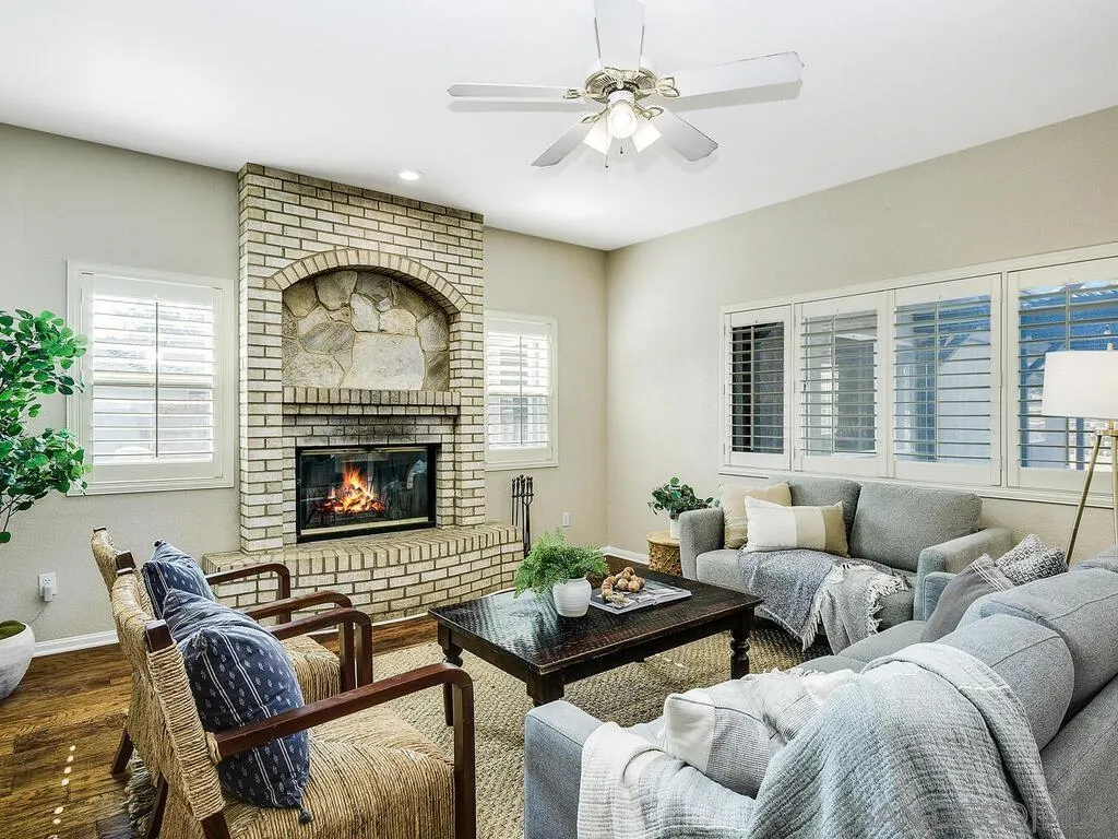 16304 Dartolo Road Ramona, CA 92065 - Photo 15 of 36 a living room with furniture and a fireplace