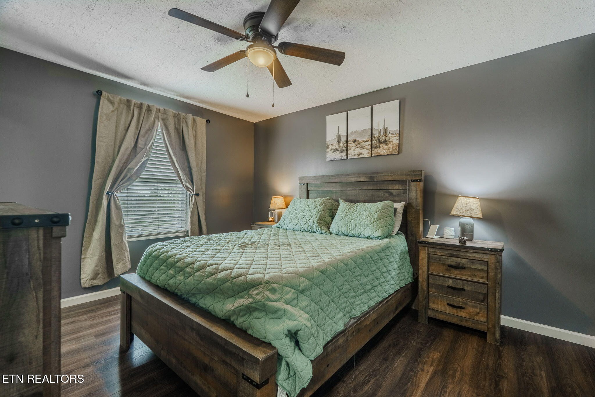 3215 Smith Road White Pine, TN 37890 - Photo 5 of 28 a bedroom with a bed and a chandelier