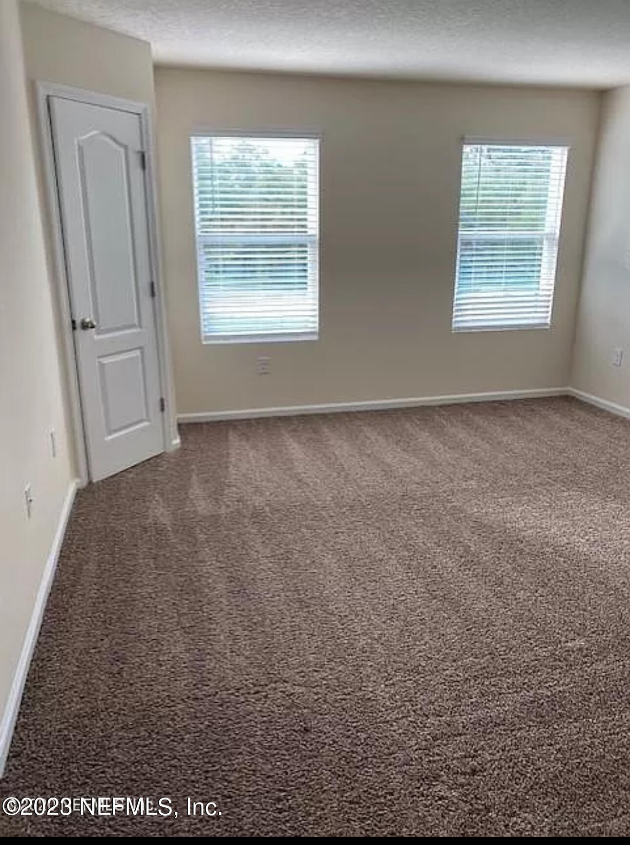 8111 Echo Springs Road Jacksonville, FL 32256 - Photo 5 of 6 an empty room with windows