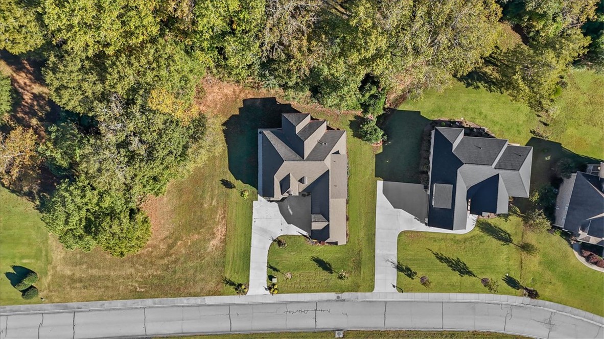 105 Bree Drive Anderson, SC 29621 - Photo 40 of 48 An aerial perspective reveals a private, tree-lined property featuring a spacious yard and inviting driveway.