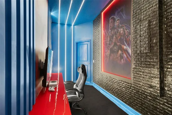 a room with painting and a lamp