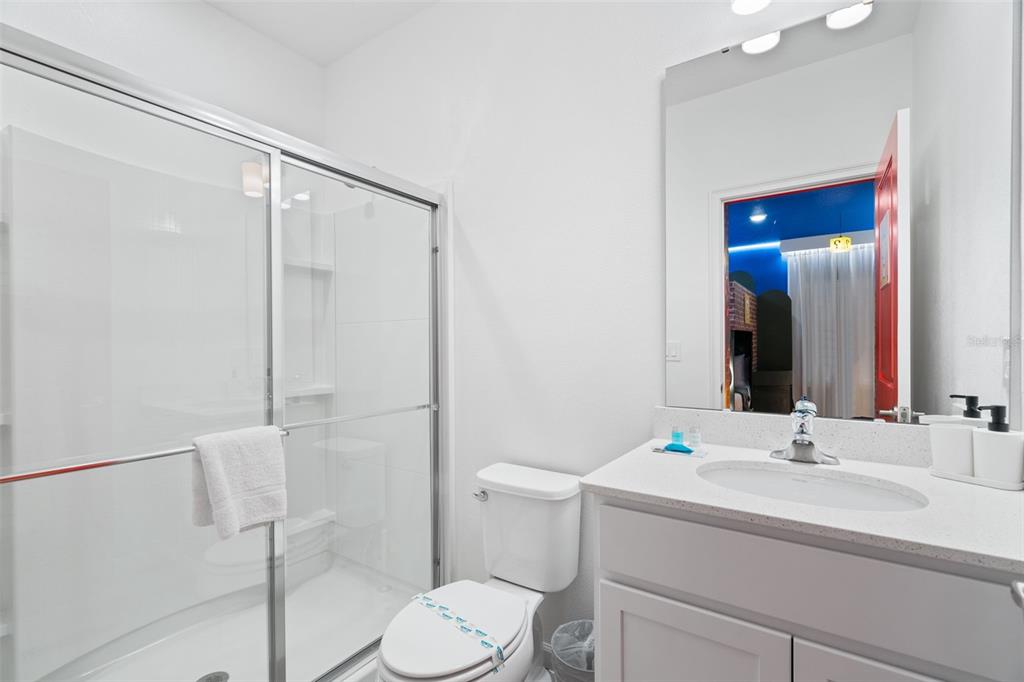 10467 Ebb Tide Lane Orlando, FL 32821 - Photo 21 of 40 a bathroom with a sink toilet and shower
