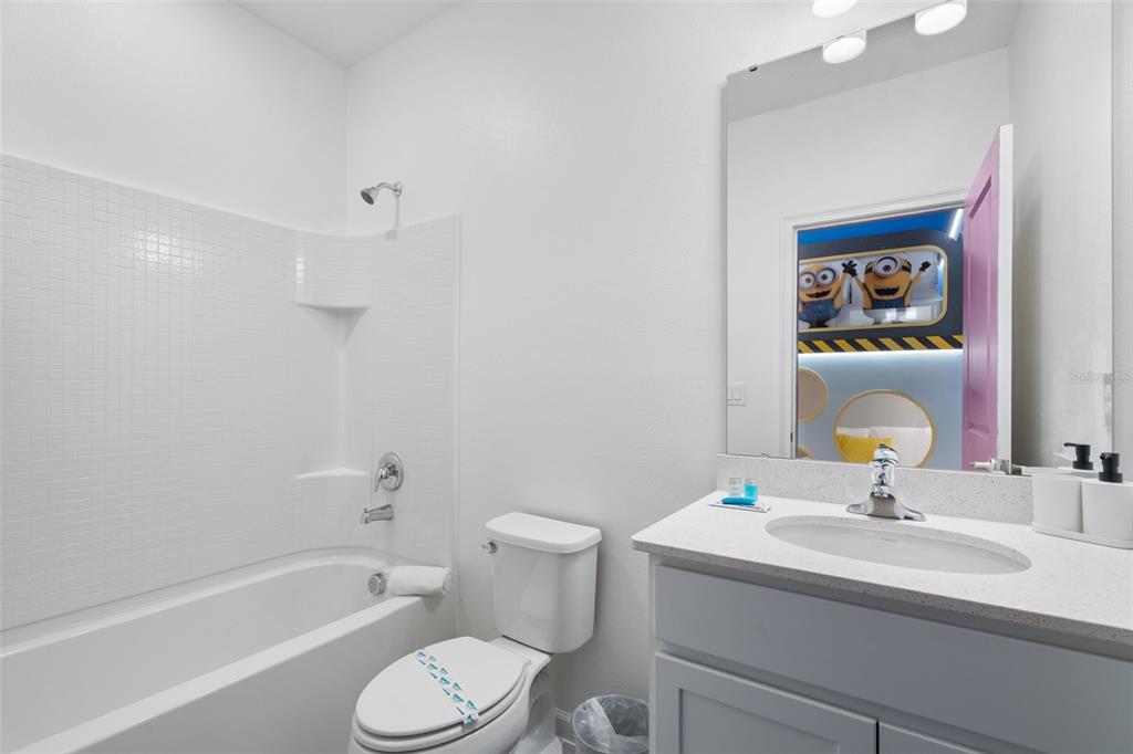 10467 Ebb Tide Lane Orlando, FL 32821 - Photo 25 of 40 a bathroom with a sink toilet and shower