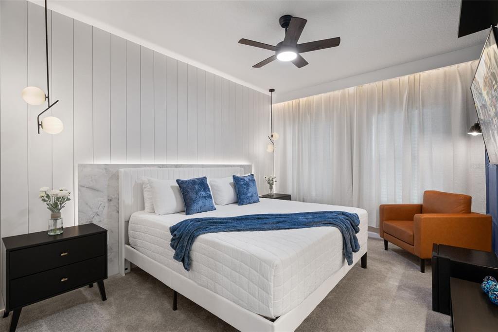 10467 Ebb Tide Lane Orlando, FL 32821 - Photo 29 of 40 a bedroom with a bed and a couch