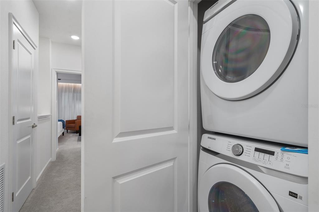 10467 Ebb Tide Lane Orlando, FL 32821 - Photo 32 of 40 a utility room with dryer and washer
