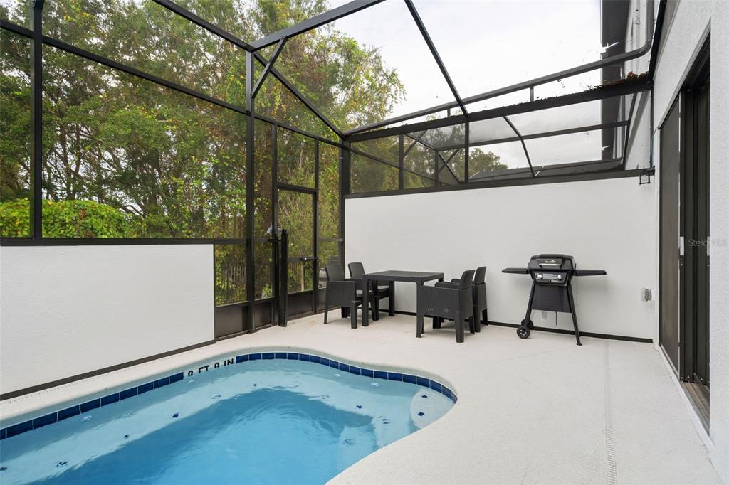 10467 Ebb Tide Lane Orlando, FL 32821 - Photo 36 of 40 a view of balcony with two chairs and a table