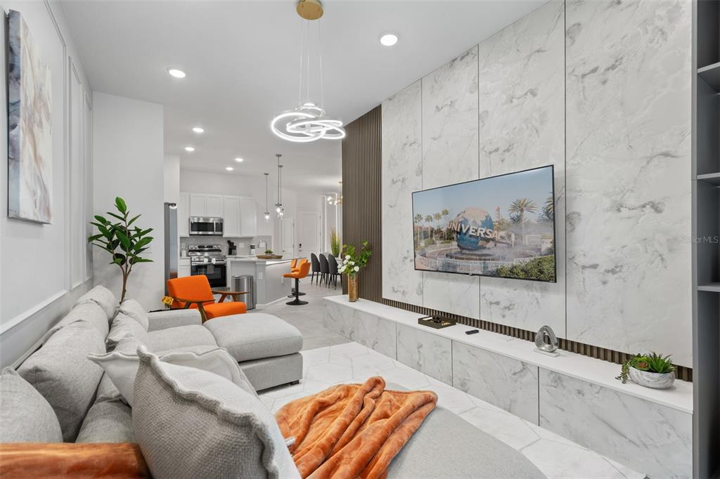 10467 Ebb Tide Lane Orlando, FL 32821 - Photo 9 of 40 a living room with furniture and a potted plant