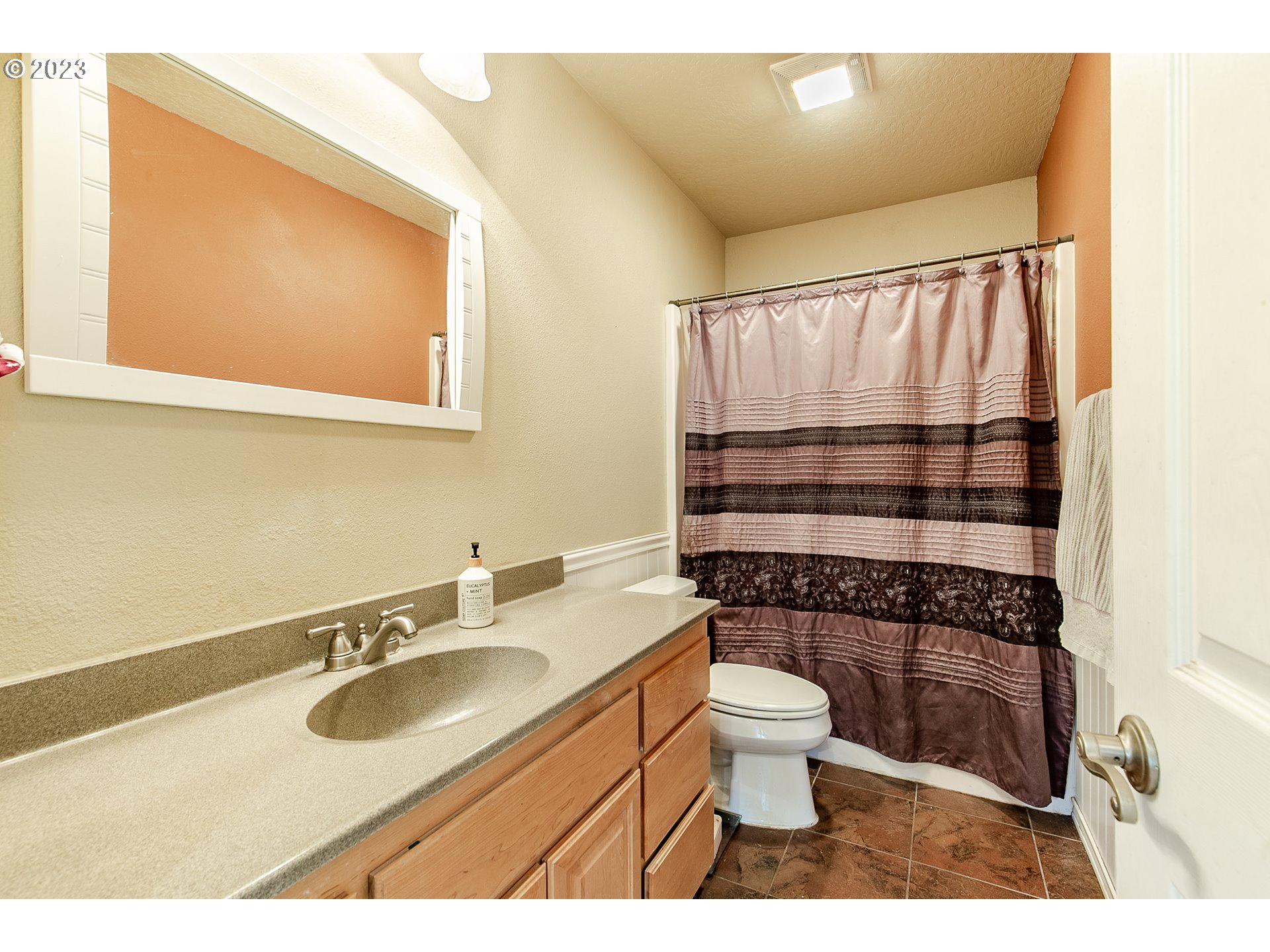 38395 Old Pengra Road Fall Creek, OR 97438 - Photo 17 of 32 a bathroom with a sink a toilet a mirror and shower