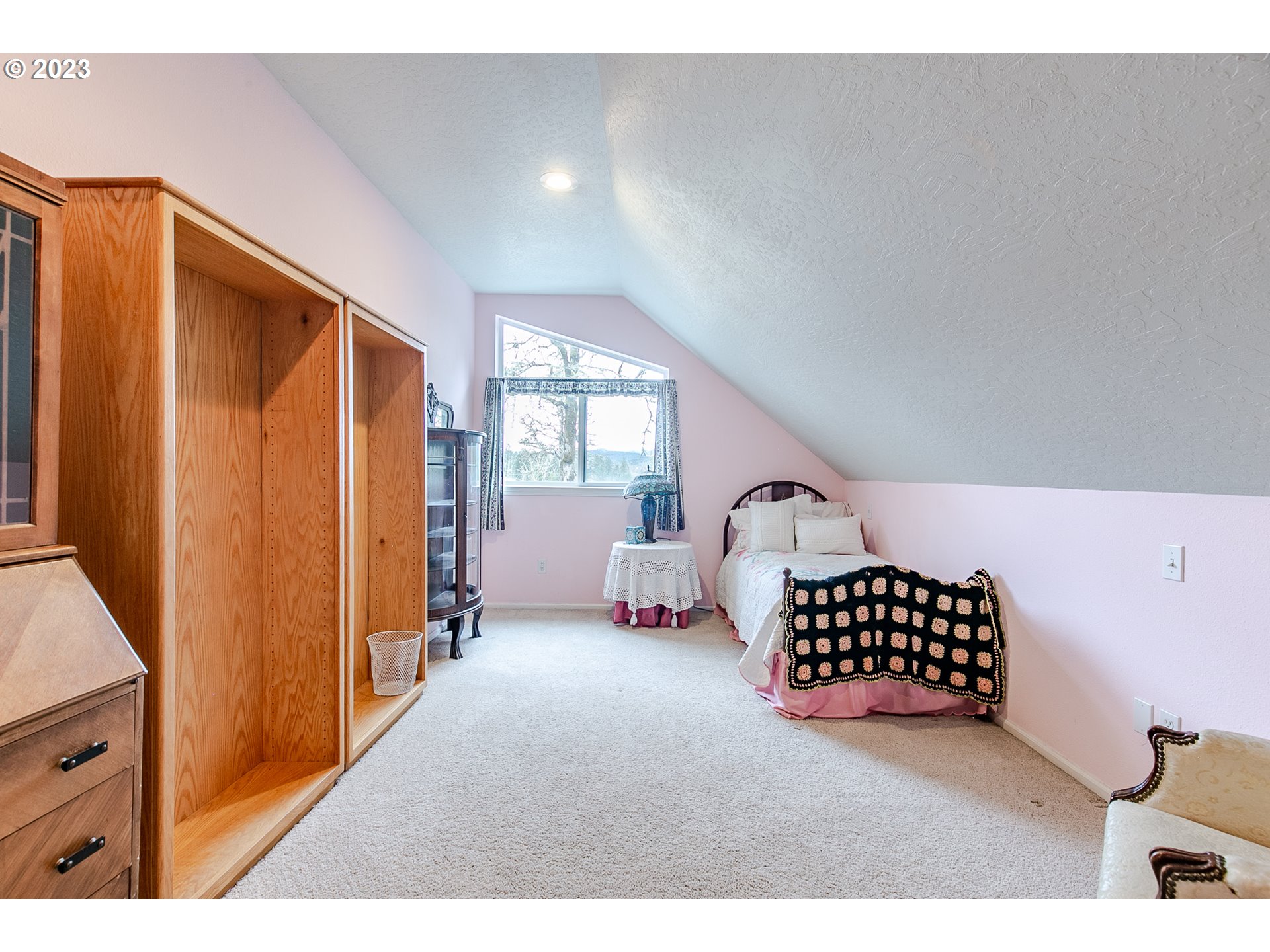 38395 Old Pengra Road Fall Creek, OR 97438 - Photo 23 of 32 a bedroom with furniture and a window