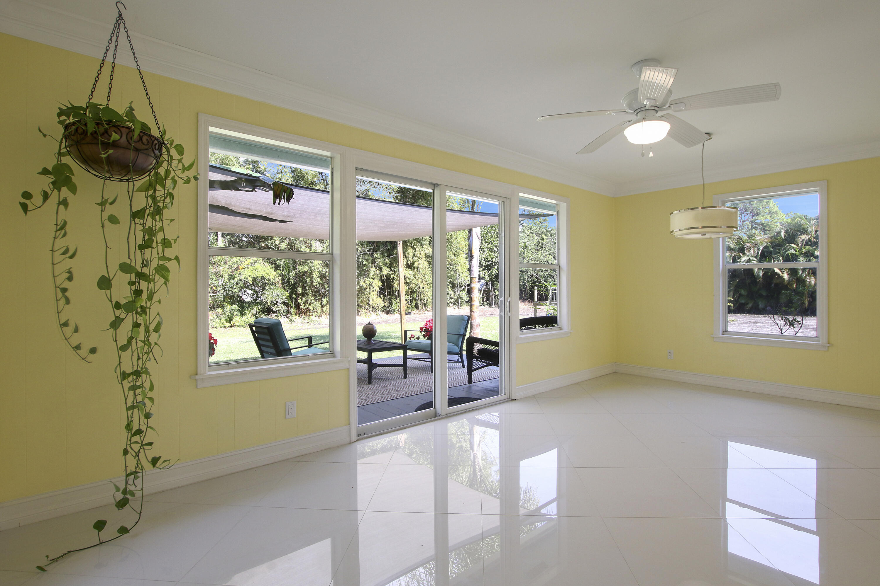 13431 153rd Road North Jupiter, FL 33478 - Photo 22 of 44 a living room with furniture and a window