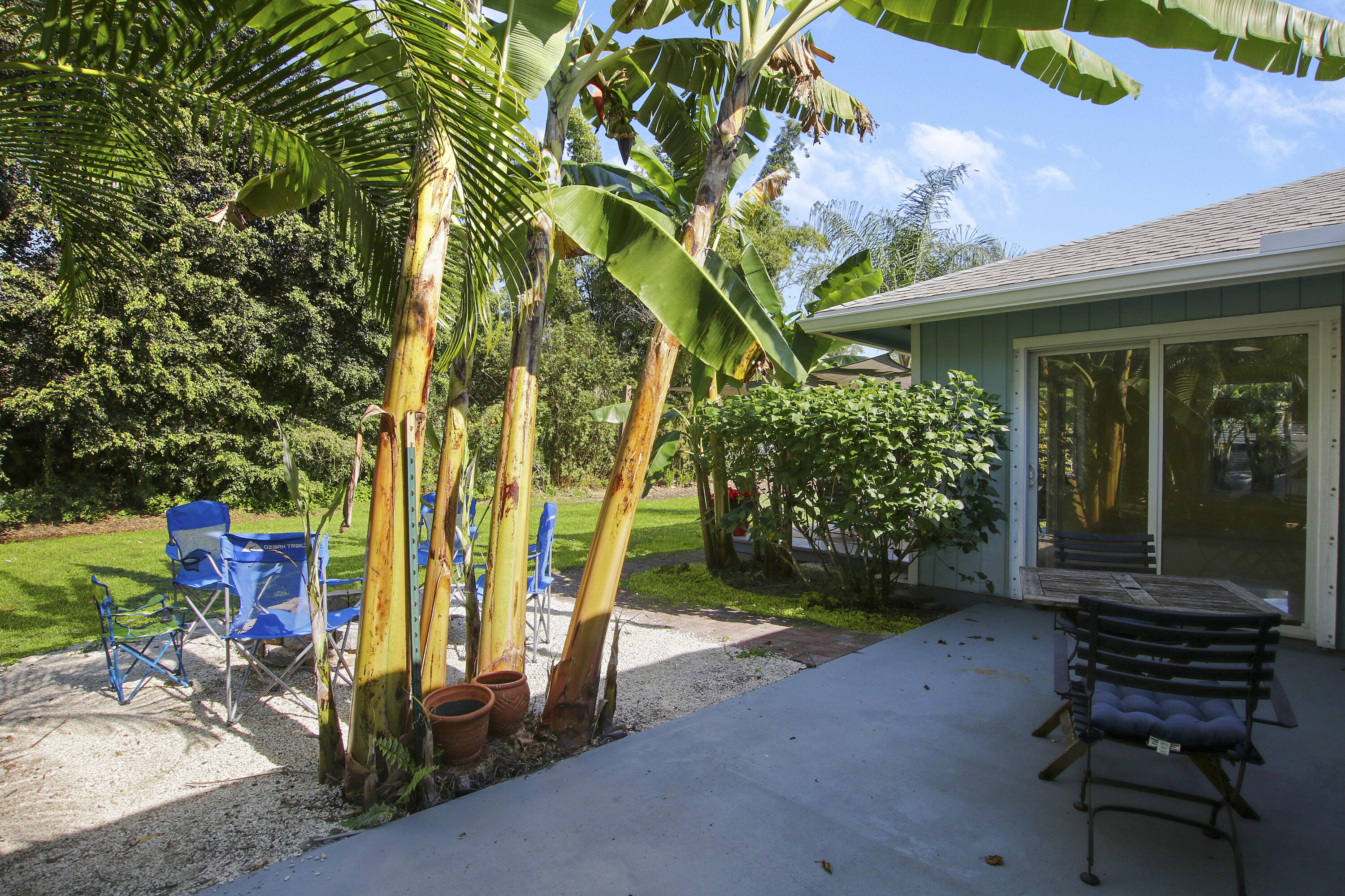 13431 153rd Road North Jupiter, FL 33478 - Photo 24 of 44 an outdoor view of a house with garden