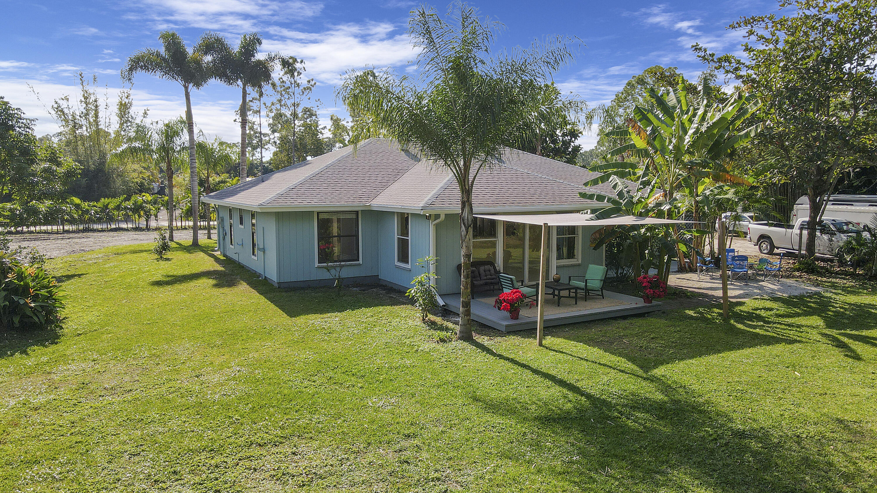 13431 153rd Road North Jupiter, FL 33478 - Photo 28 of 44 a view of a house with swimming pool and sitting area