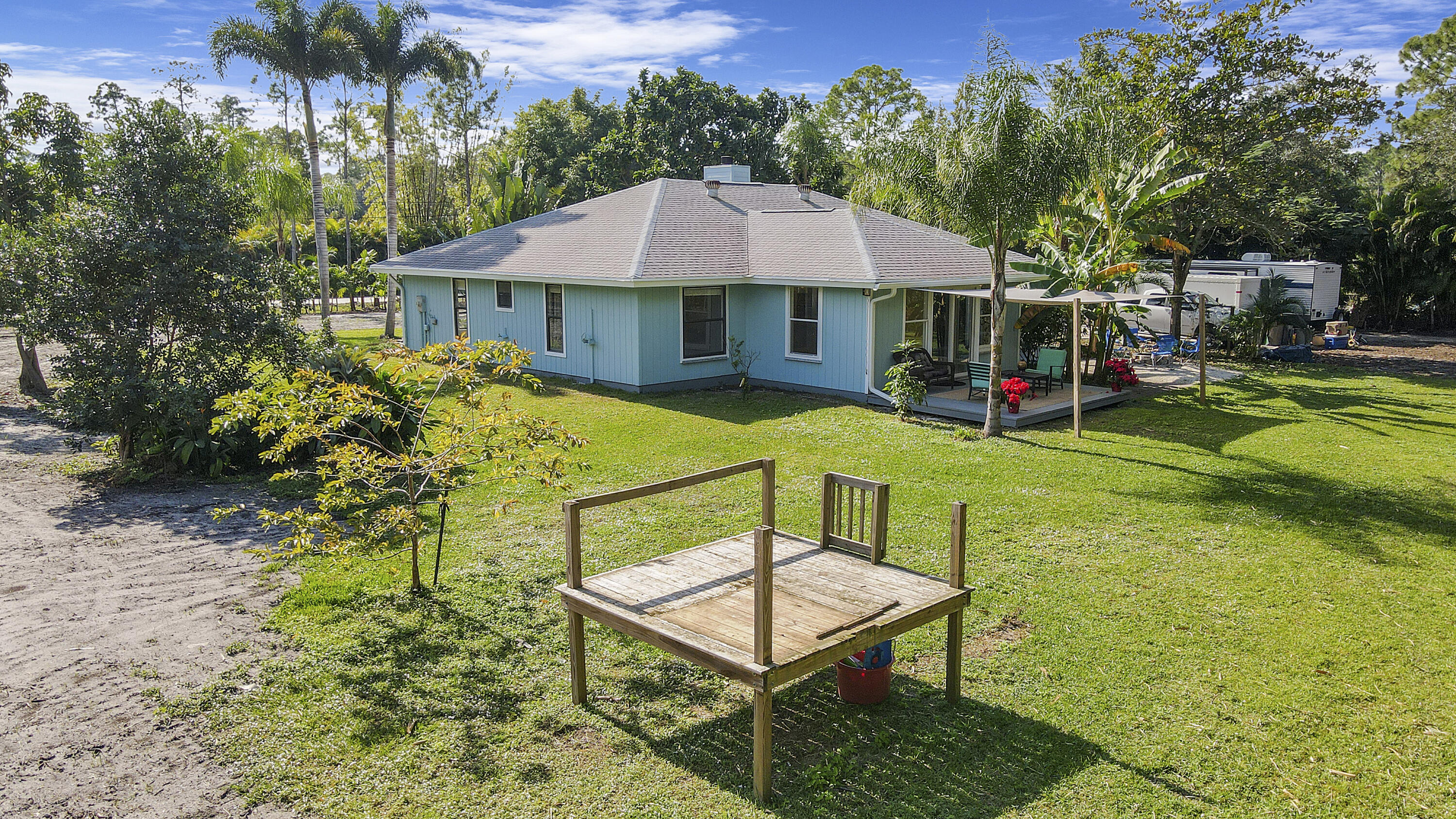 13431 153rd Road North Jupiter, FL 33478 - Photo 35 of 44 a view of a house with backyard and sitting area